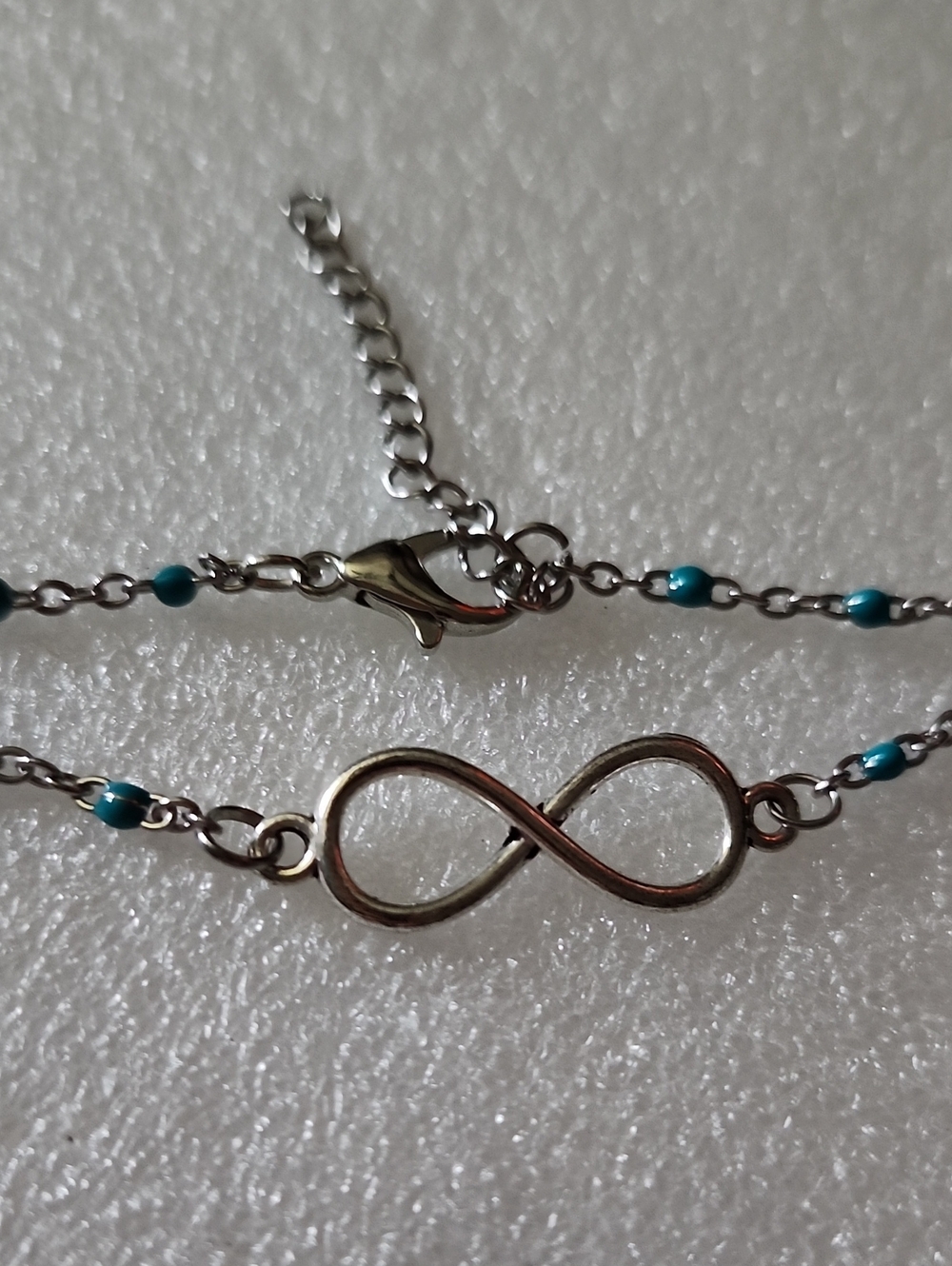 Hand Crafted Silver Infinity Bracelet with Turquoise Accents